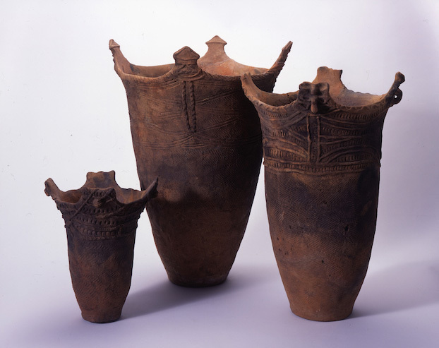 a decorated cylindrical earthenware pot from the Goshono Site in Iwate Prefecture