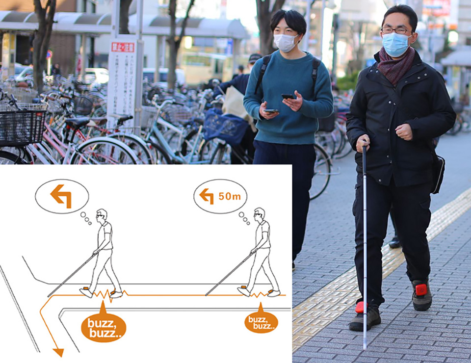 Ashirase uses location information from smartphones to determine users’ routes. The device, with a built-in motion sensor and electronic compass, vibrates to guide the user to the destination.